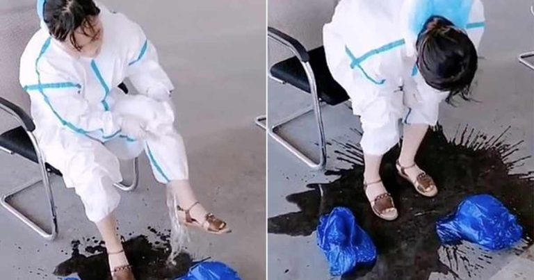 Pekerja Medis di Tiongkok Menuangkan ‘Ember Keringat’ dari Baju Hazmat-nya